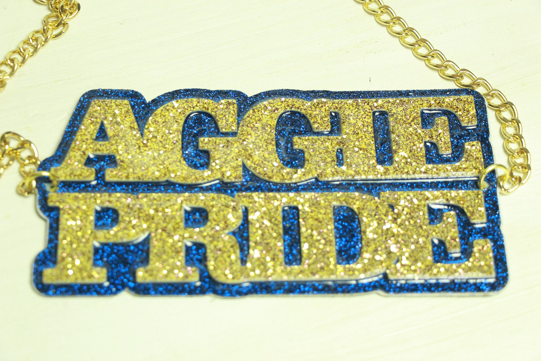 Team spirit chain AGGIE PRIDE in gold and blue glitter